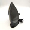 A close-up, side view of the sole of a black iron. Voir les images du produit