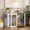 A dog is resting inside a wooden dog crate that doubles as a side table, with decorative items on top. Náhľad obrázku produktu