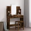 A vanity table with a mirror and stool, set against a plain wall with curtains in the background. Náhled obrázku produktu
