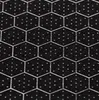 A close-up view of a black surface with a hexagonal pattern and small white dots. Náhľad obrázku produktu