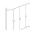 Close-up of a white metal bed frame with decorative spherical elements on vertical bars. Produktbild-Vorschau