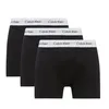 Three black Calvin Klein boxer briefs are arranged in a staggered formation against a white background. Náhľad obrázku produktu