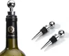 A wine bottle with a stopper and two additional stoppers on a white background. Produktbild-Vorschau
