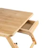 A close-up view of a wooden laptop table with an open drawer. Produktbild-Vorschau