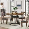 A round dining table with four chairs in a well-lit dining room. Náhľad obrázku produktu