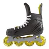 A side view of a black Bauer inline hockey skate with yellow wheels, set against a white background. Podgląd zdjęcia produktu