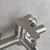 A close-up view of a brushed nickel bathroom faucet. Produktbild-Vorschau