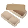 A beige, two-tiered lunchbox with a divider in the bottom compartment, shown with the lid open and placed above the base. Podgląd zdjęcia produktu