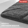 Close-up of a dark gray bath mat with a textured surface, showing its edge and texture. Produktbild-Vorschau