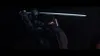 A warrior in dark armor with a sword raised. Produktbild-Vorschau