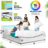 A family is interacting on a bed with LED lighting. Produktbild-Vorschau