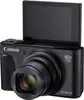 A black Canon PowerShot digital camera with its screen flipped up. Podgląd zdjęcia produktu