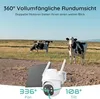 A security camera with a solar panel in a field with cows. Produktbild-Vorschau