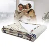 A family hugging in front of a window with a folded blanket in the foreground. Produktbild-Vorschau