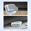 Two images showing a white and gray charging case for Apple AirPods Pro, with one image showing it on a stand and the other showing it on a couch. Produktbild-Vorschau