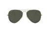 A pair of gold-rimmed aviator sunglasses with green lenses against a white background. Náhled obrázku produktu