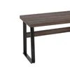 A close-up of a desk with a wooden top and black metal legs. Anteprima dell’immagine prodotto