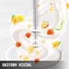 A stainless steel milkshake maker with a double head is shown mixing milk and fruit, creating a dynamic swirl effect. Produktbild-Vorschau