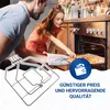 A father and daughter are in a kitchen, taking a baking tray out of an oven. Produktbild-Vorschau