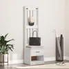 A white coat rack with a seat and drawer, a hat and a bag on it, and an umbrella stand next to it. Podgląd zdjęcia produktu