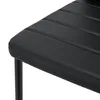 A close-up of a black chair seat and leg. Podgląd zdjęcia produktu