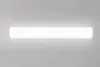 A long, white LED light fixture mounted on a light gray wall. Produktbild-Vorschau