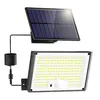 A solar-powered floodlight with a separate solar panel, connected by a wire. Produktbild-Vorschau