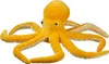 A yellow plush octopus toy is shown against a white background. Anteprima dell’immagine prodotto