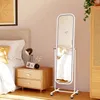 A bedroom scene with a bed, nightstand, and a full-length mirror. Podgląd zdjęcia produktu