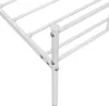 A close-up view of the corner of a white metal bed frame, showing the leg and support structure. Podgląd zdjęcia produktu