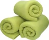 Three rolled-up fleece blankets are stacked on a white background. Produktbild-Vorschau
