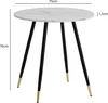 A round marble-look dining table with three black legs tipped with gold. Produktbild-Vorschau