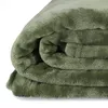 A folded olive green blanket. Produktbild-Vorschau