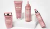 Four Kérastase hair products are displayed on white pedestals against a white background. Produktbild-Vorschau