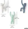 Three colorful hooks shaped like climbing figures are shown with measurement indicators. Náhled obrázku produktu
