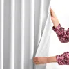 Hands pulling back a white curtain. Produktbild-Vorschau