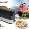 A couple enjoying a meal outdoors with a toaster in the foreground. Náhľad obrázku produktu