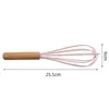 A pink whisk with a wooden handle is shown against a white background, with dimensions indicated. Produktbild-Vorschau