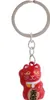 A red lucky cat keychain on a white background. Produktbild-Vorschau