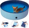 A dog is playing in a blue pool, with three smaller images below showing how to fold the pool. Anteprima dell’immagine prodotto