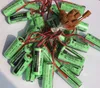 A pile of green lithium batteries with red and black wires and brown connectors. Náhled obrázku produktu