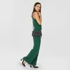 A woman is posing with a handbag. Produktbild-Vorschau
