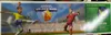The image shows the packaging of a Tipp-Kick Mania Migros Edition football game, featuring two player figurines and game elements. Produktbild-Vorschau