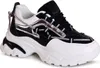 A studio shot of a single black and white women's sneaker with silver accents.