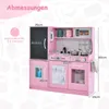 A pink wooden toy kitchen with various accessories and dimensions labeled. Produktbild-Vorschau