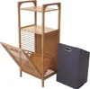 A bamboo shelf unit with a laundry basket next to it, presented on a white background. Podgląd zdjęcia produktu