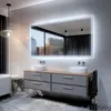 A modern bathroom with a large LED mirror, double vanity, and bathtub. Produktbild-Vorschau