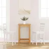 A bar table with two bar stools in a room with windows. Voir les images du produit