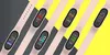 A collage of fitness trackers with different watch faces displayed on a diagonal background of gray and yellow. Podgląd zdjęcia produktu