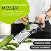 A person is using a mandoline slicer to cut a cucumber, with sliced cucumbers and whole cucumbers visible. Produktbild-Vorschau